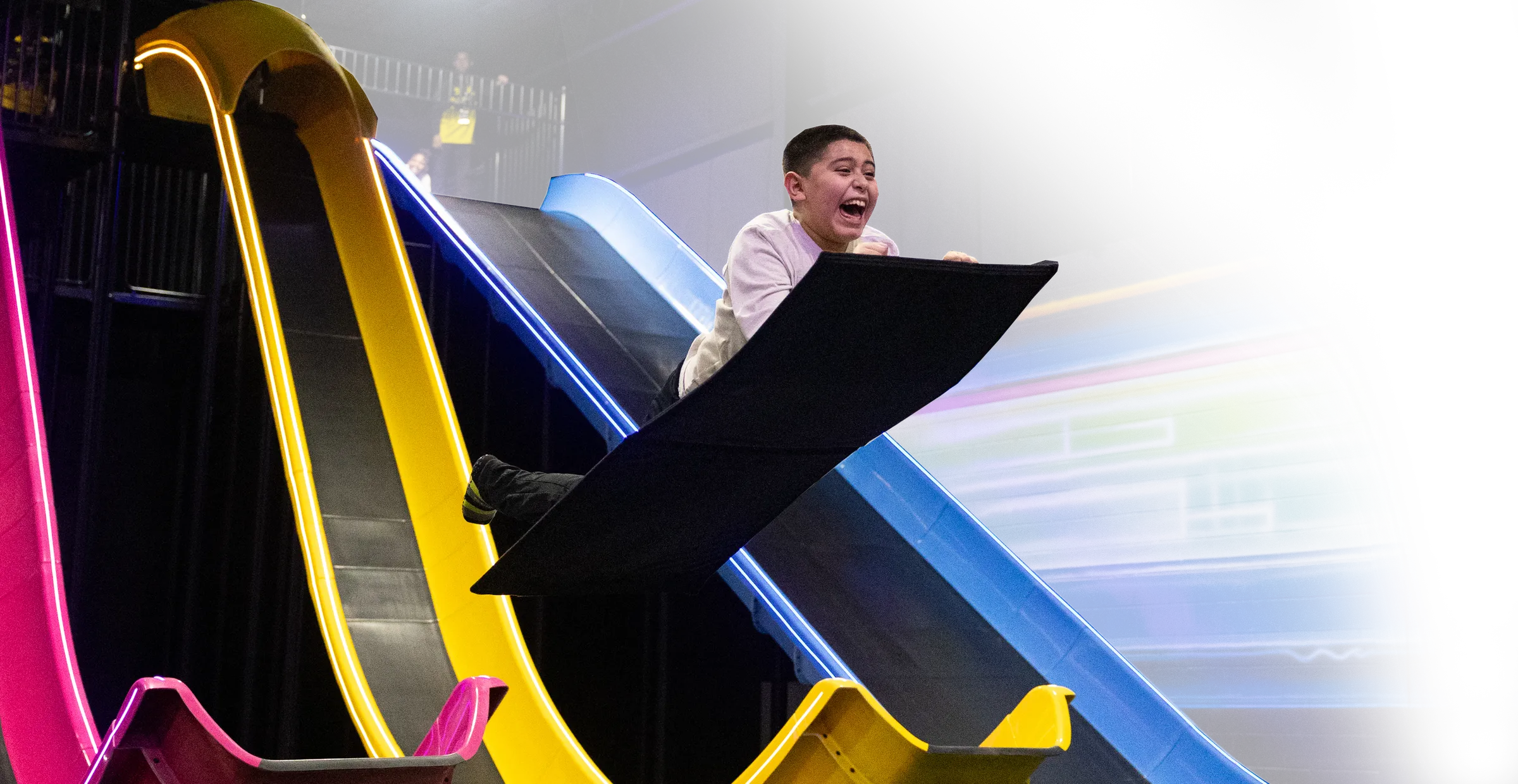 child on mega launch slide
