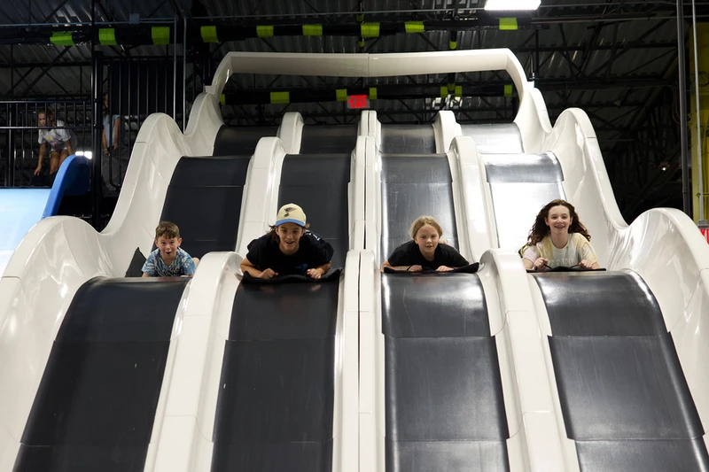children racing on Fast Lane slide at Slick City Action Park in Pigeon Forge TN
